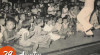 Foto Soerjono (Pak Kasur) saat mengajar anak-anak bernyanyi dalam siaran untuk anak cacat dari Jajasan Pemeliharaan Anak-Anak Tjatjat (JPAT) di Studio RRI Jakarta. 29 Agustus 1957.