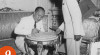 Foto Dr. Alfian Yusuf Helmi sedang menandatangani surat-surat pengangkatan sebagai Duta Besar Luar Biasa dan Berkuasa Penuh RI untuk Swiss, tanggal 9 Oktober 1951